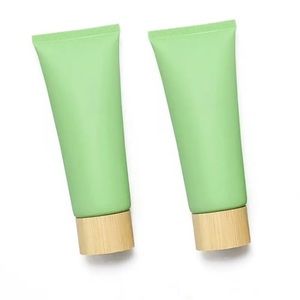 Matte green empty lotion bottles